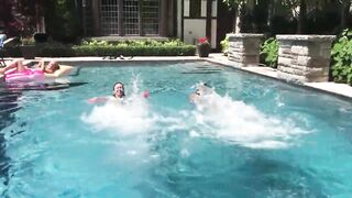 Two Bikini Teens challenging each other in pool