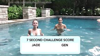 Two Bikini Teens challenging each other in pool