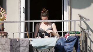 This nice mom gets some sun in bra during the lockdown