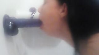 Sucking Purple Dildo in Shower