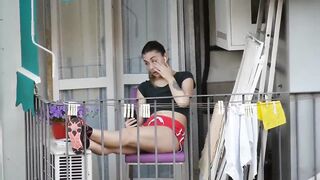 Candid girl relaxing on the balcony