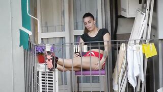 Candid girl relaxing on the balcony