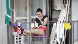 Candid girl relaxing on the balcony