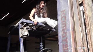 She Climbs a Forklift and Pedal Pumps in Sexy Tights with Boots