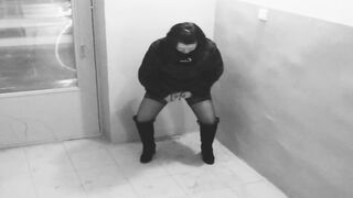 The Girl Takes off as a Girlfriend Pissing in a Public Entrance