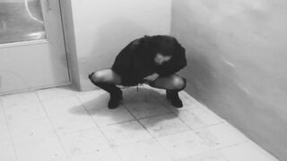 The Girl Takes off as a Girlfriend Pissing in a Public Entrance