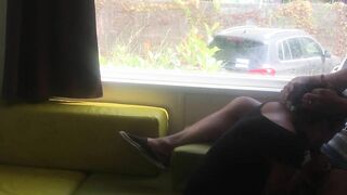 Wife giving risky blowjob in front of window in a camper van