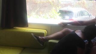 Wife giving risky blowjob in front of window in a camper van