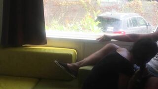 Wife giving risky blowjob in front of window in a camper van