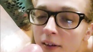 Cute blonde gets cum on her face from a BWC and sucks it dry