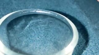 Closeup dripping cum in shot glass slo-mo