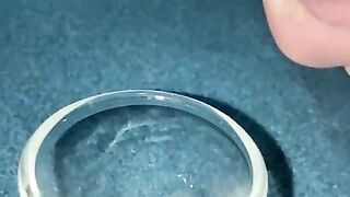 Closeup dripping cum in shot glass slo-mo