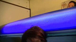 Glasses girl is pissing and gets fucked in public solarium