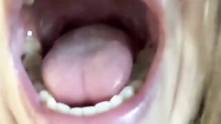 Wilde open mouth, teeth and tongue. Close view for my throat.