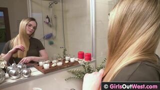 Sexy blonde showers and toys her horny pussy