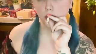 Smoking in pig tails with a flower crown