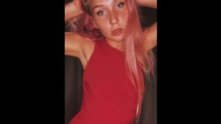 Girl in a sexy red dresss moking a cigarette and dancing