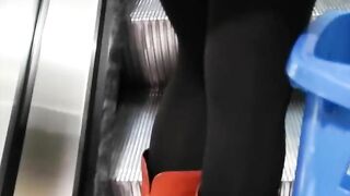 Fully dressed crossed legs orgasm in a store