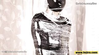 Fejira com Full body wrapped in tight latex clothing and plastic wrap