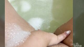 Horny girl masturbating while taking a bubble bath