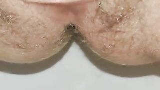 Extremely close up wide open hairy pussy pissing for your pleasure