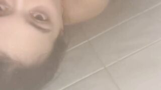 HORNY TATTOOED BRUNETTE SUCKS COCK AND SWALLOWS CUM IN THE SHOWER