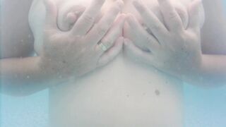 Nipple play in the pool