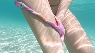 girl takes off her panties pussy underwater and swims naked